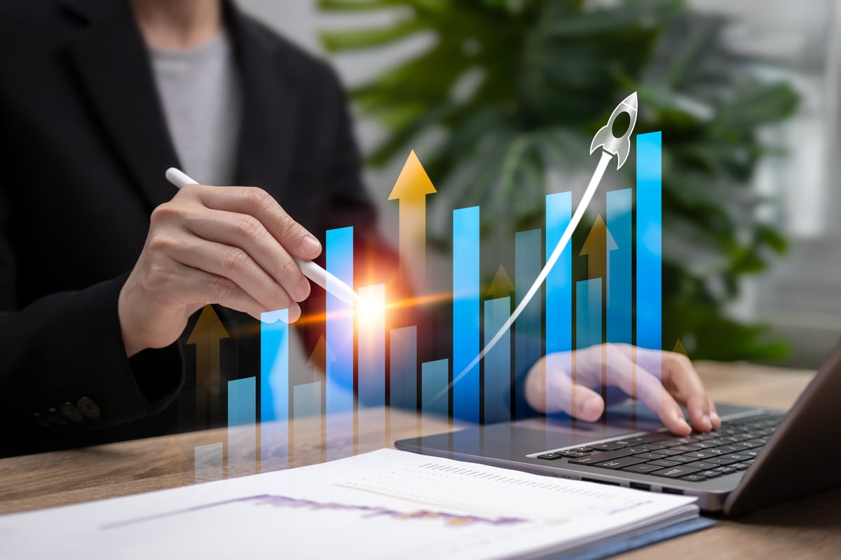 Business team reviewing financial performance charts during a venture investment meeting